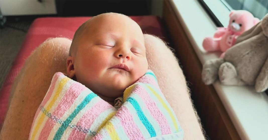 Sleeping baby wrapped in a blanket