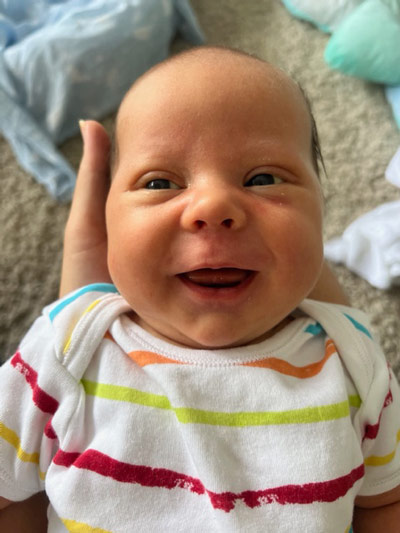 smiling newly born baby