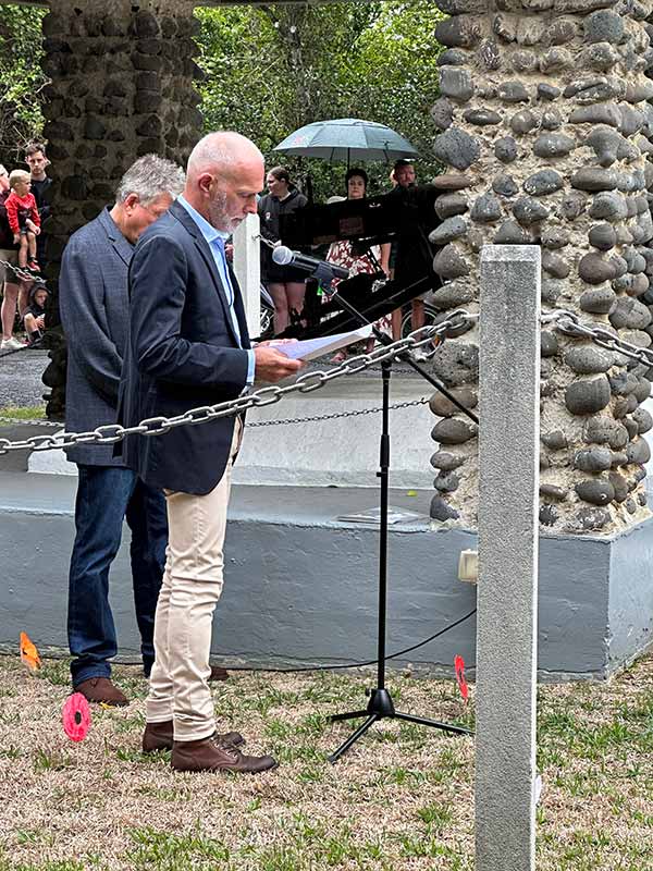 A speaker speaks at the commemoration ceremony held at the Lord Howe Island Cenotaph on Anzac Day.