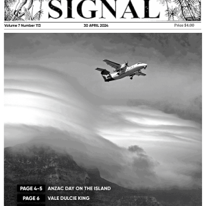 This is the front cover of the April Lord Howe Island Signal. The beautiful black and white front cover image is of the beautiful foreshore on Lord Howe Island. With mountain in the background covered by cloud and the Qantaslink plane flying in the sky.