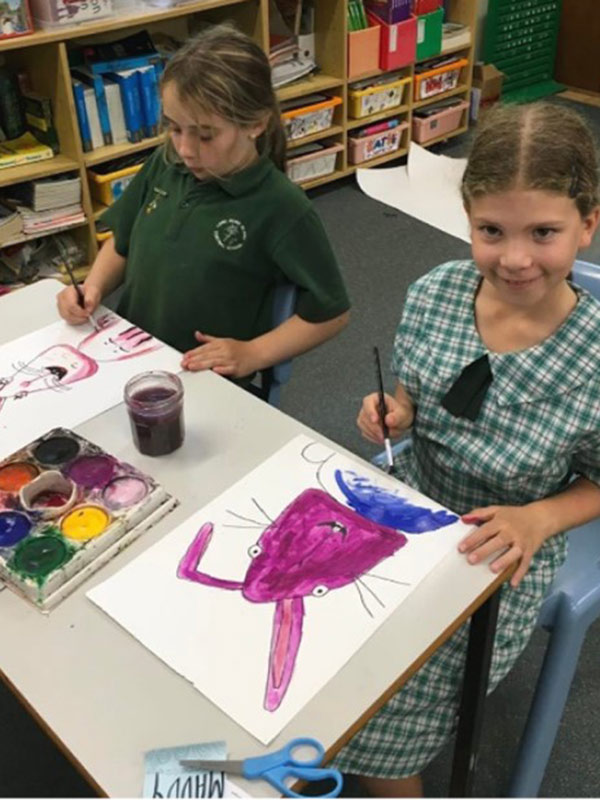 Lord Howe Island Central School students are painting easter bunnies.