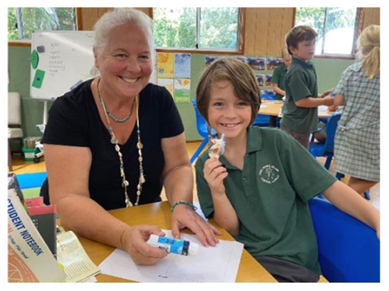 A teacher and student at Lord Howe Island Central school working on their writing task.