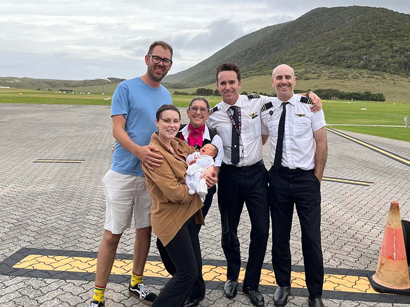 A photo of baby Birdie Joy Tierney and parents Dennis and Sally at the Lord Howe Island airport.