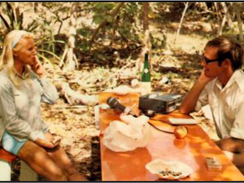 An image of Julie Booth being interviewed by photographer Malcolm Kirk on Wreck Island.