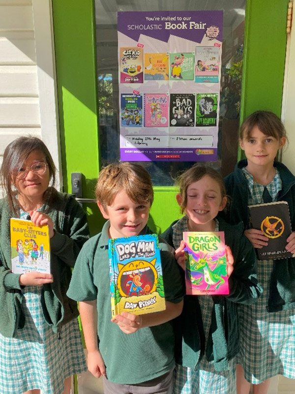 Lord Howe Island Central School students showing their books at the recent Book Fair.