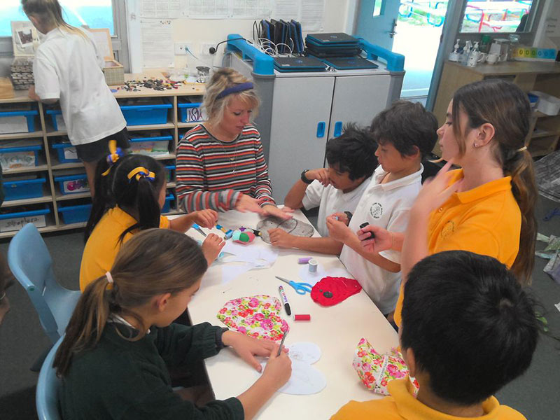 3-6 class showing they are clever hands at sewing