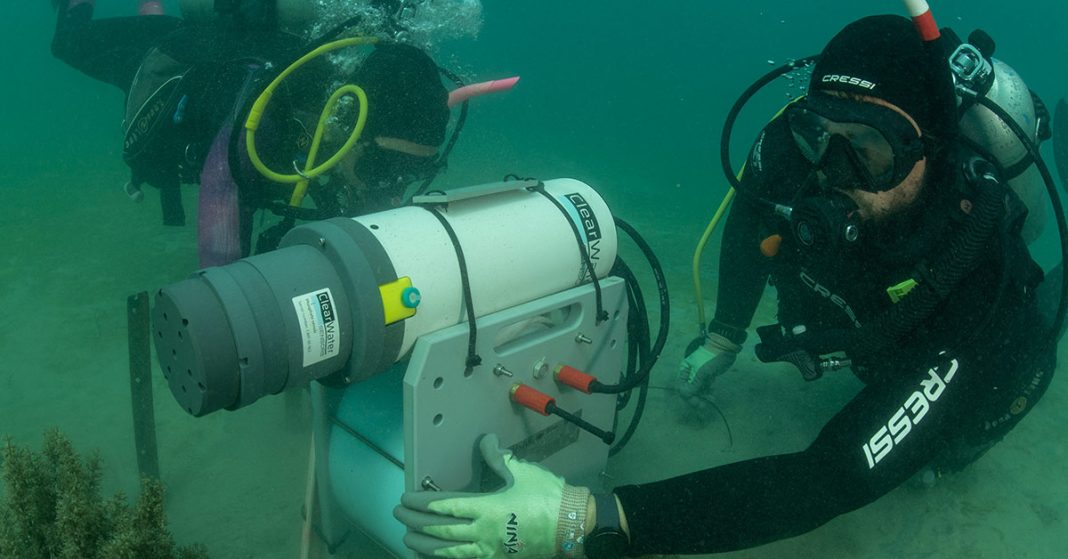 AIMS researchers deploying a nutrient sensor in the LHIMP. Photo credit NSW DPI