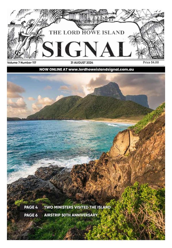 This is the front cover of the Lord Howe Island Signal for August 2024, Issue 117. It features an image which captures the stunning landscape of Lord Howe Island, featuring the prominent Mount Lidgbird and Mount Gower in the background. The Island's lush greenery, pristine beaches, and crystal-clear waters create a picturesque and serene environment.