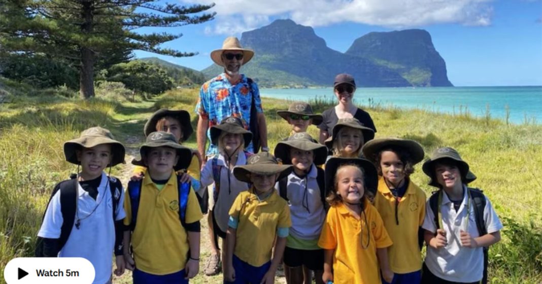 An image of Lord Howe Island school students making their way to school barefoot