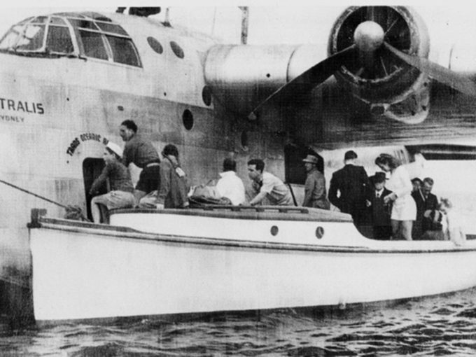 From the book “Pinetrees – Lord Howe Island -1842-1992” by Kerry McFadyen. The caption reads: “Trans Oceanic Airways flying boat with ‘Albatross’ alongside, with Kirb at the wheel, about 1948”