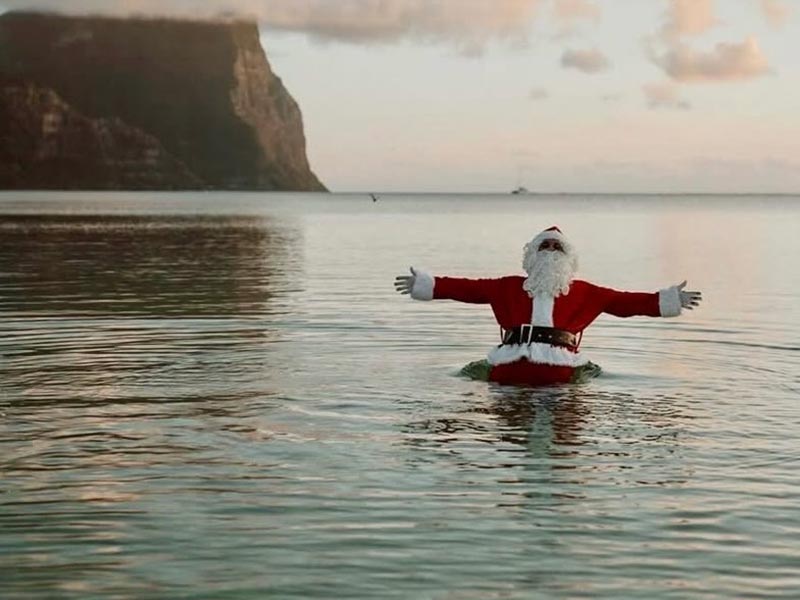 Christmas on Lord Howe Island - santa in the water at the beach