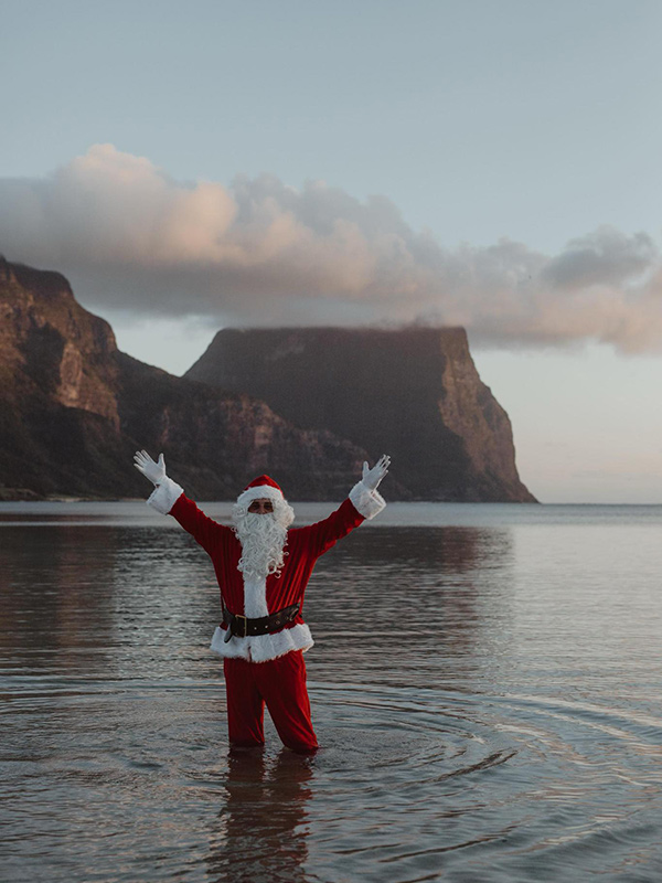 Christmas on Lord Howe Island - santa in the water at the beach